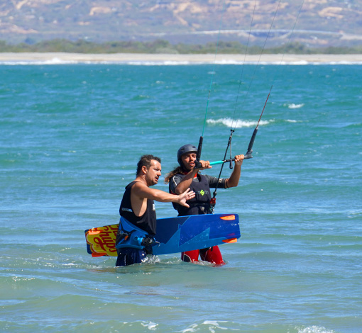 instructor with student teaching kitesurf course by oaxakite